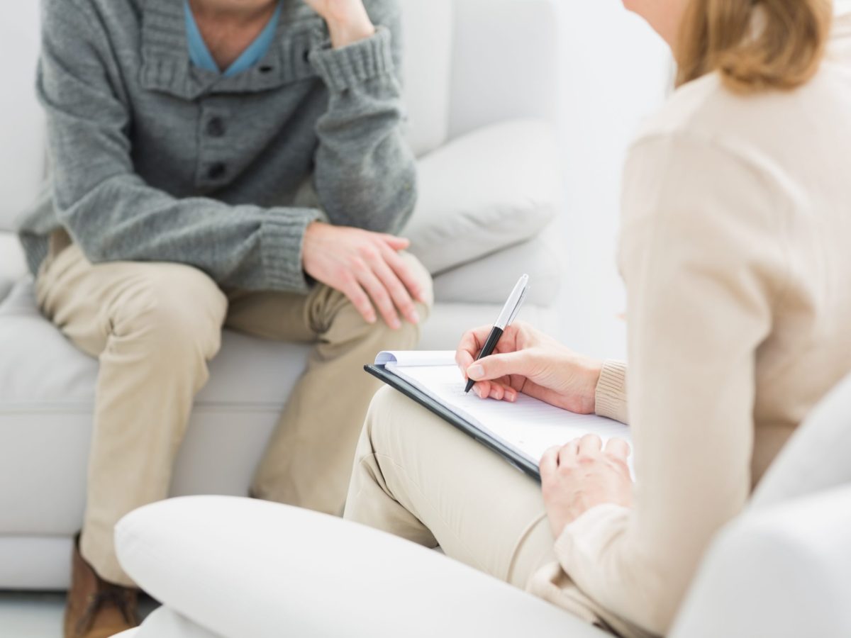 Young man in meeting with a psychologist in her office